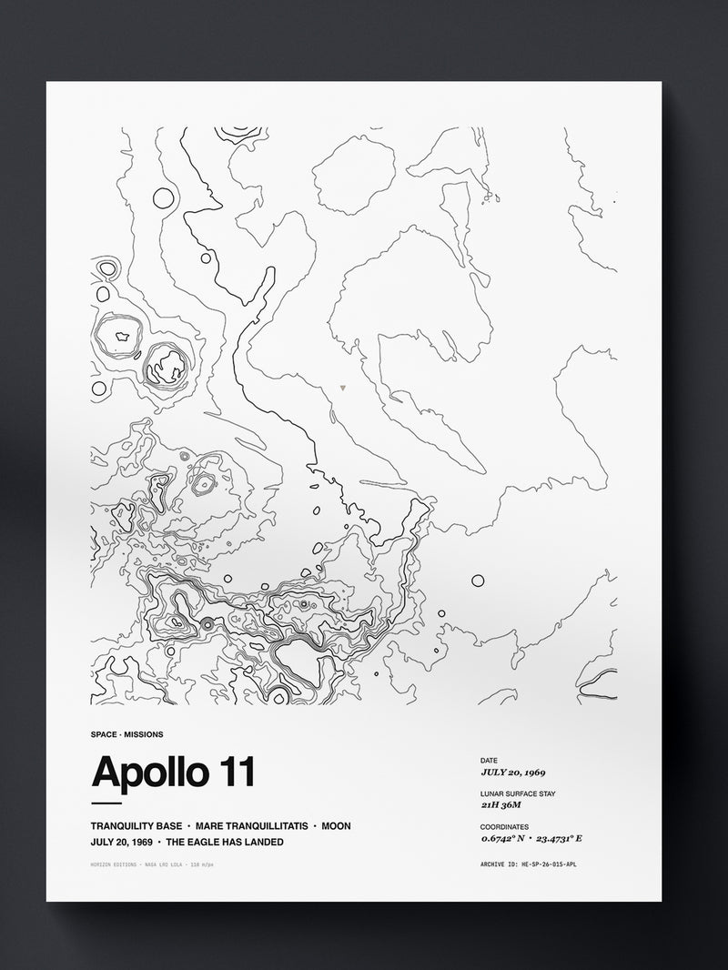 Topographic contour print of Apollo 11, Mare Tranquillitatis (Tranquility Base), the Moon, the July 20, 1969 landing site, rendered from NASA LRO LOLA laser altimetry. Museum-quality 250gsm matte archival print by Horizon Editions - real terrain, hand-drawn, no AI.